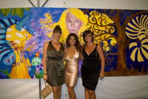 Tracee Badway and Friends in front of the Green Tie Ball Mural